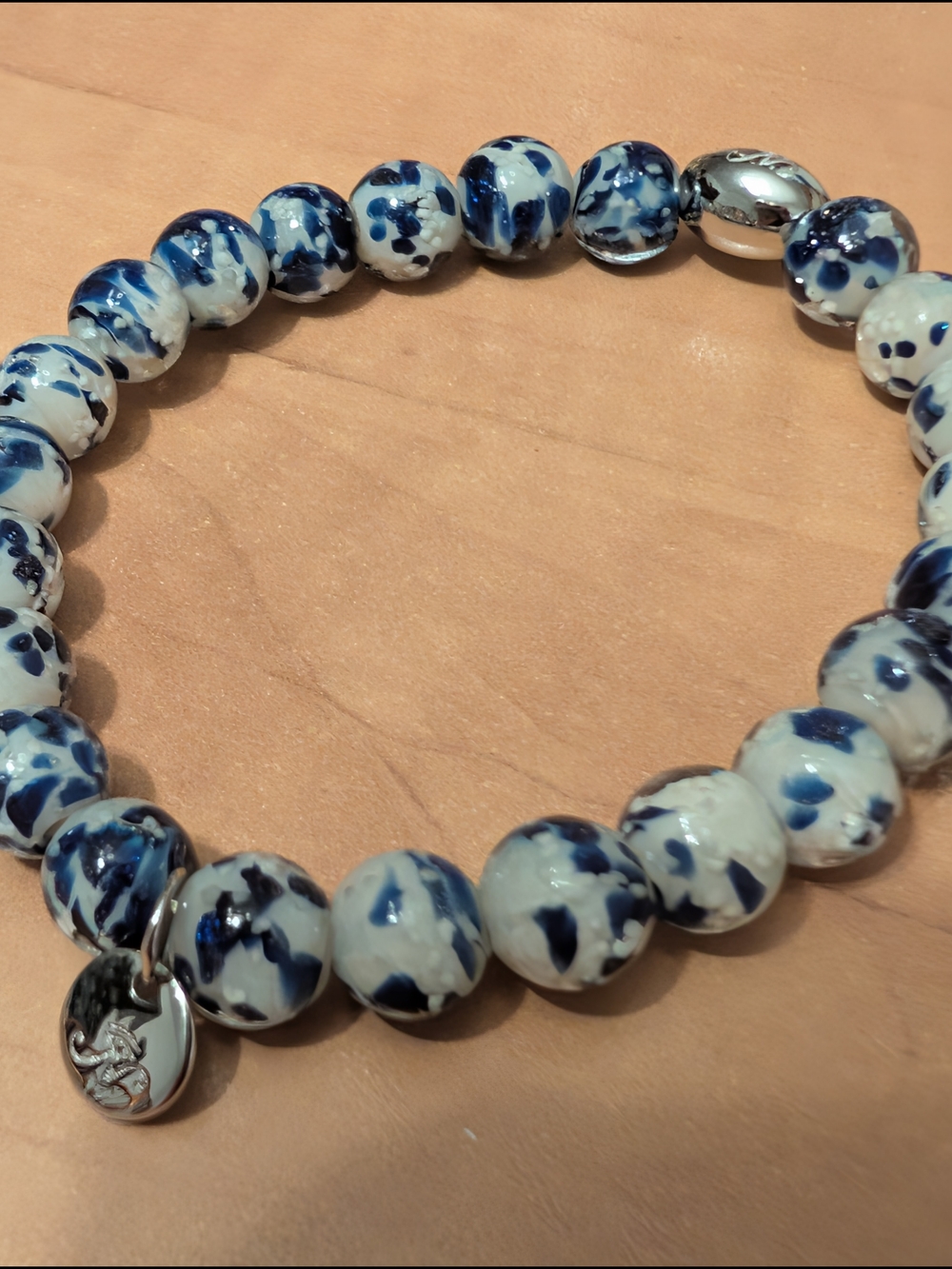Blue and White Beaded Stretch Bracelet with Silver Charm